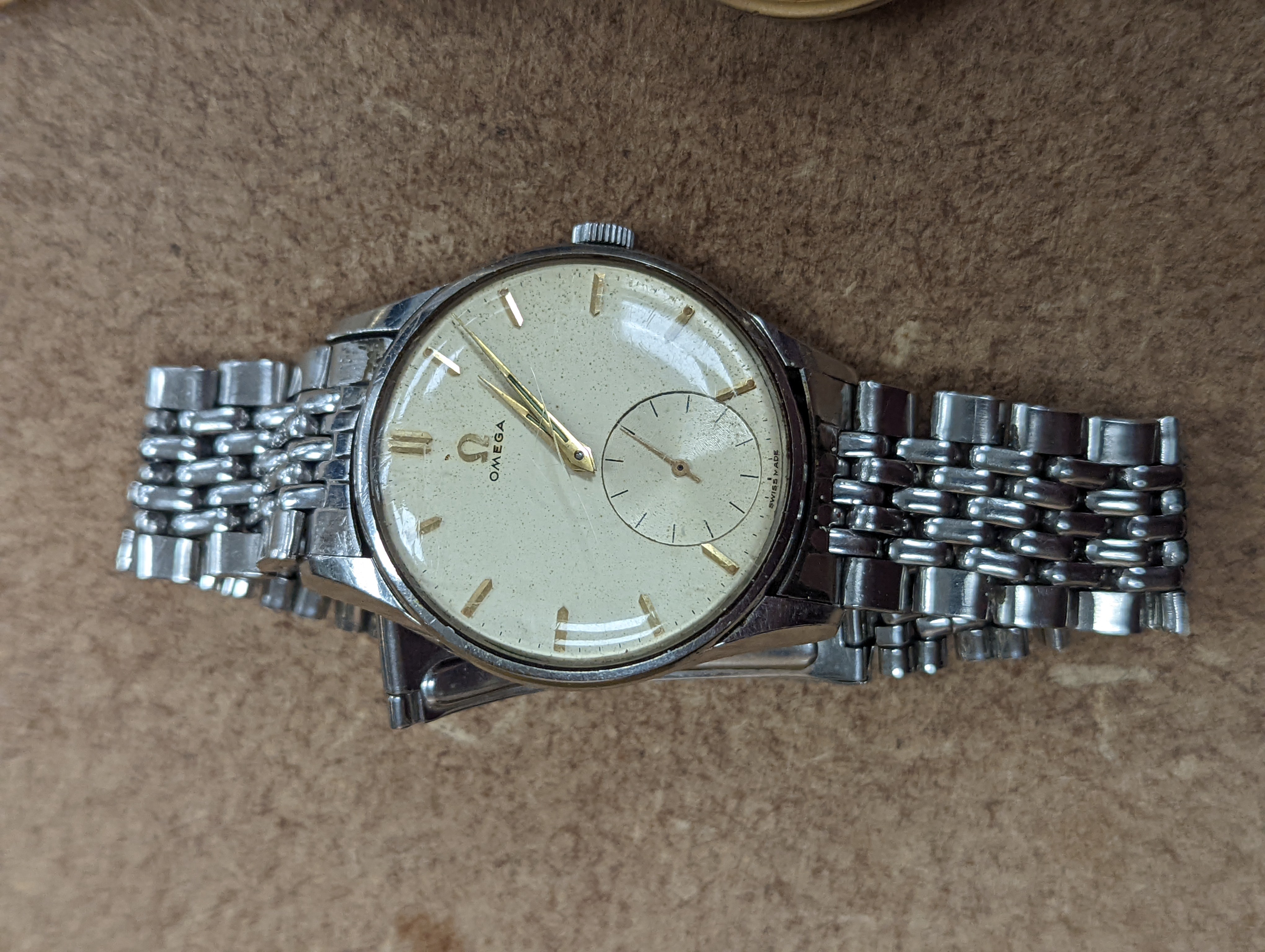 A gentleman's mid 20th century stainless steel Omega manual wrist watch, case diameter 35mm, on associated bracelet, together with eight other assorted wrist watches including Seiko and Silvan, an Oris pocket watch and t